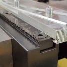 Image - Long Serrated Grips Maintain Contact on Full-Length of Workpiece; Perfect for Demanding Applications